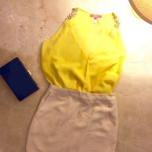 Yellow blouse with gold flower straps. Worn once